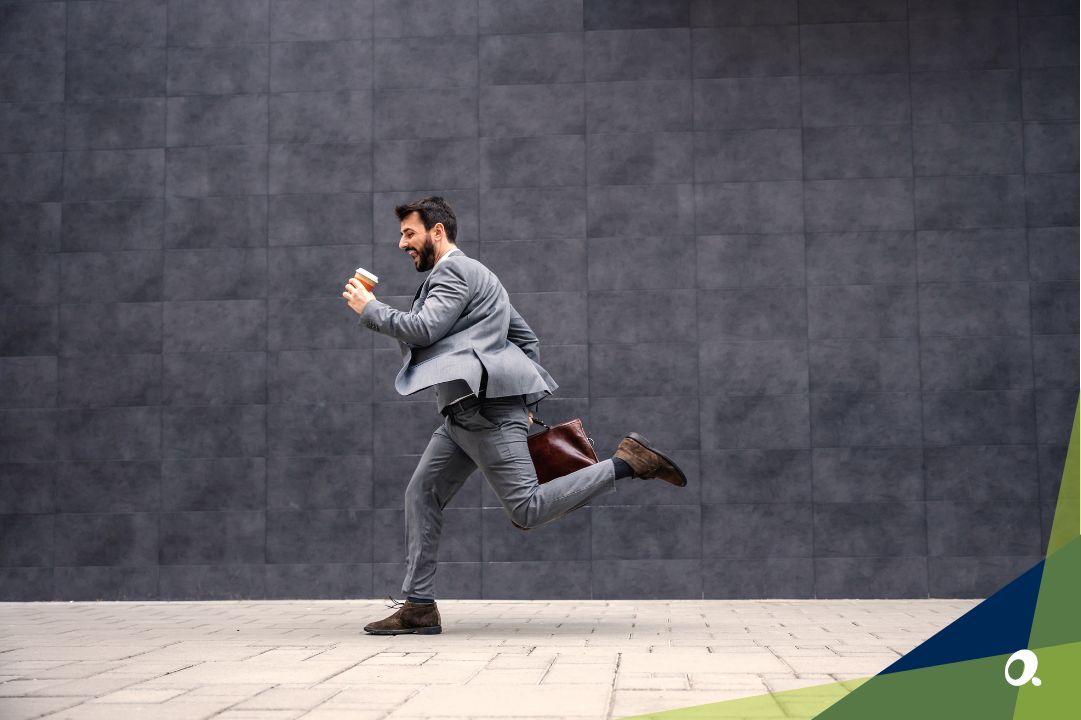 Finance professional running with coffee in hand