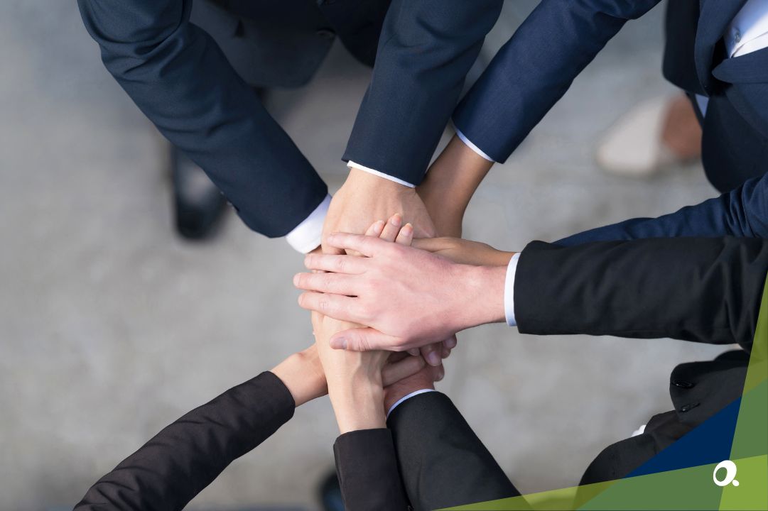 Professional finance team putting hands in