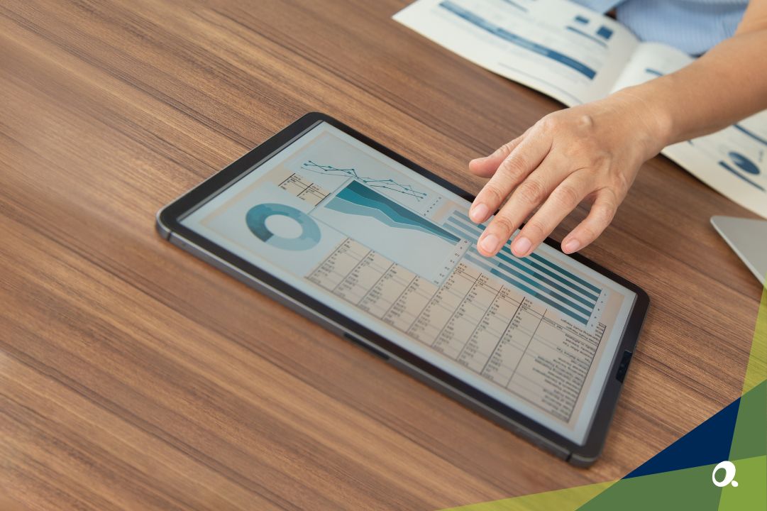 Hand hovering over a tablet with a cloud ERP system