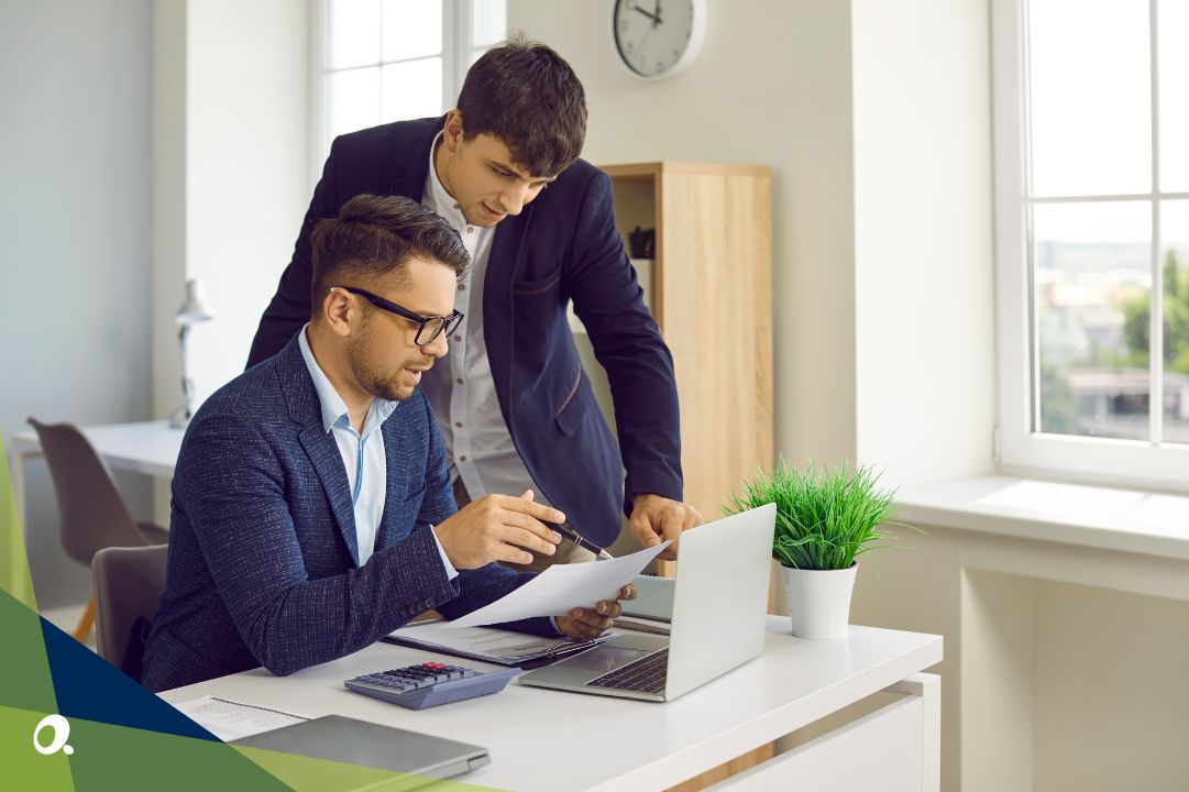 Finance professionals looking at financial reports