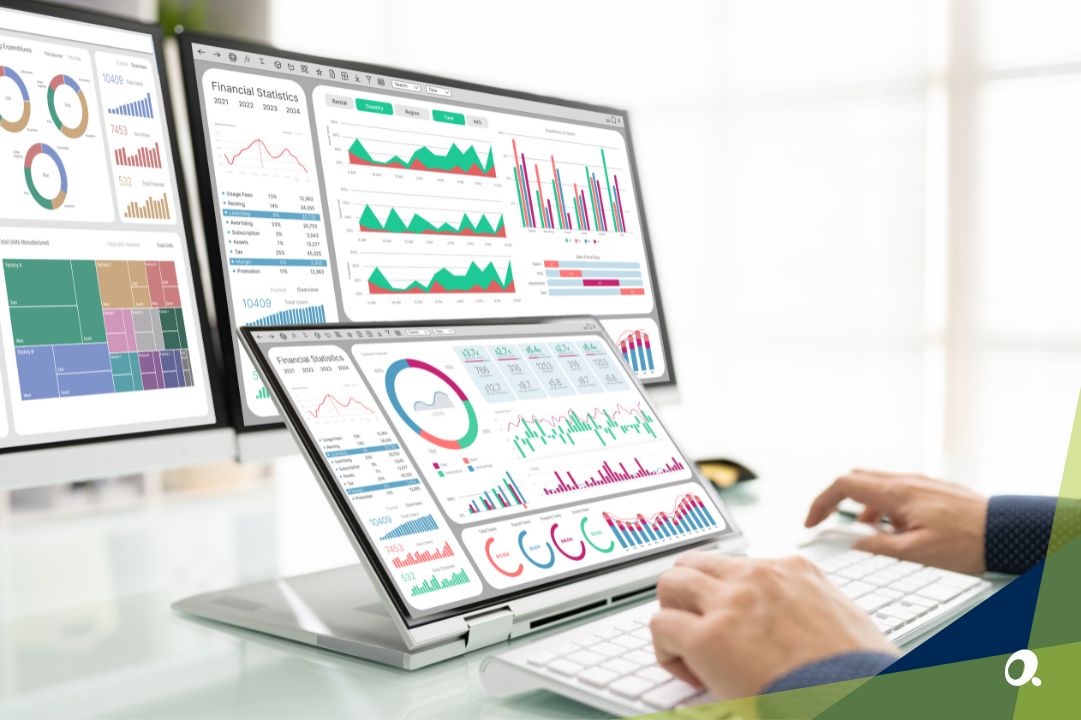 Multi-screen display showing real-time financial dashboards and performance charts for construction project tracking.
