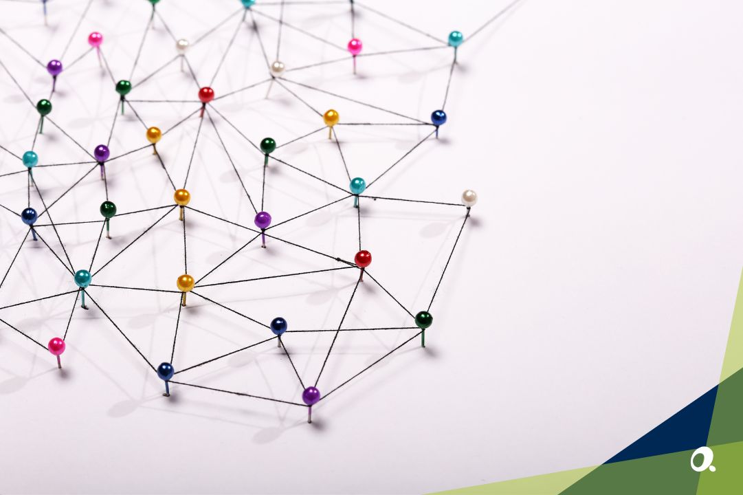 Network of coloured map pins connected by string, representing the complexity of multi-entity structures and the links between finance processes.