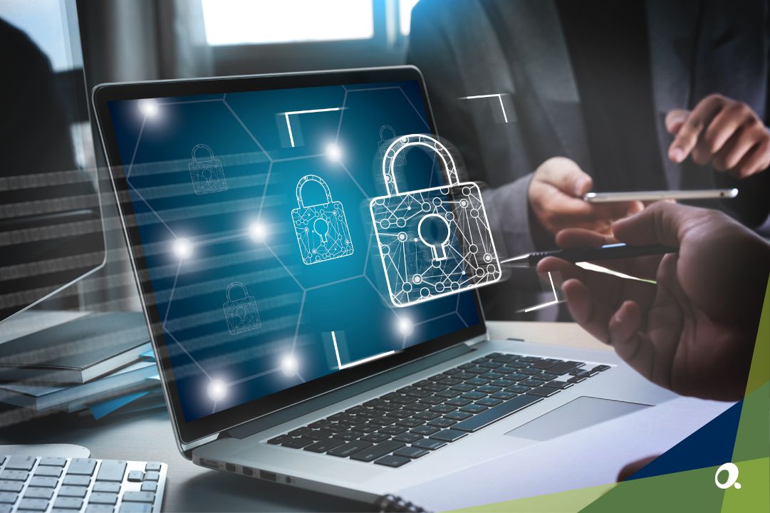 Finance professional using a laptop with graphics of advanced security
