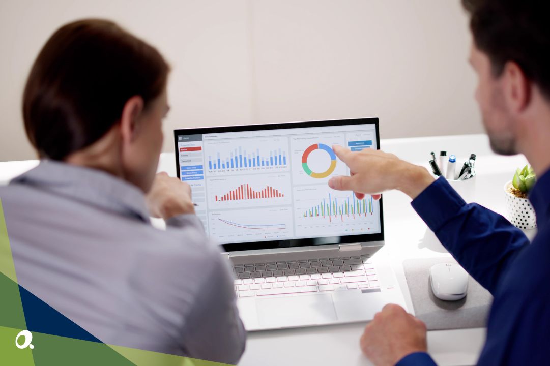 Finance professionals discussing reports across different business systems